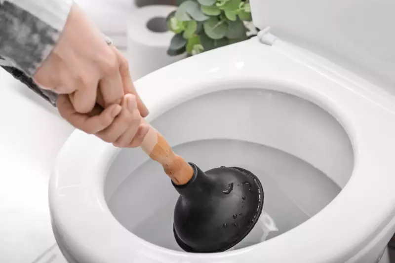Plunging a clogged Toilet