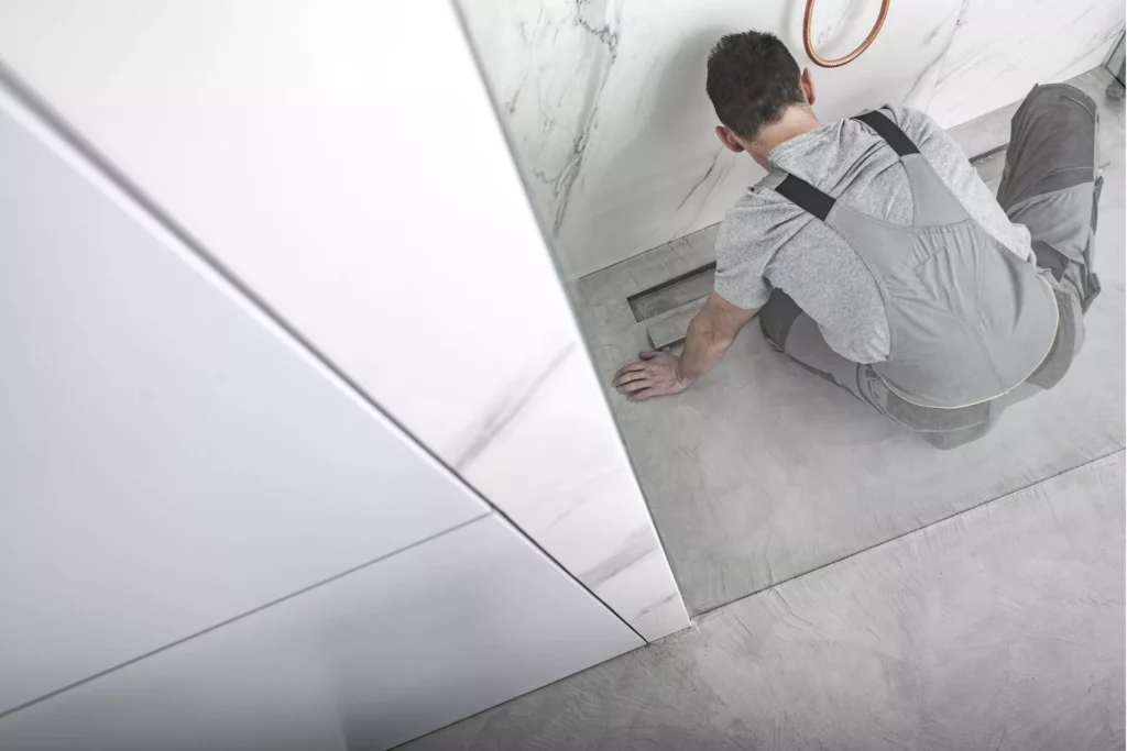 plumber installing interior drain tiles