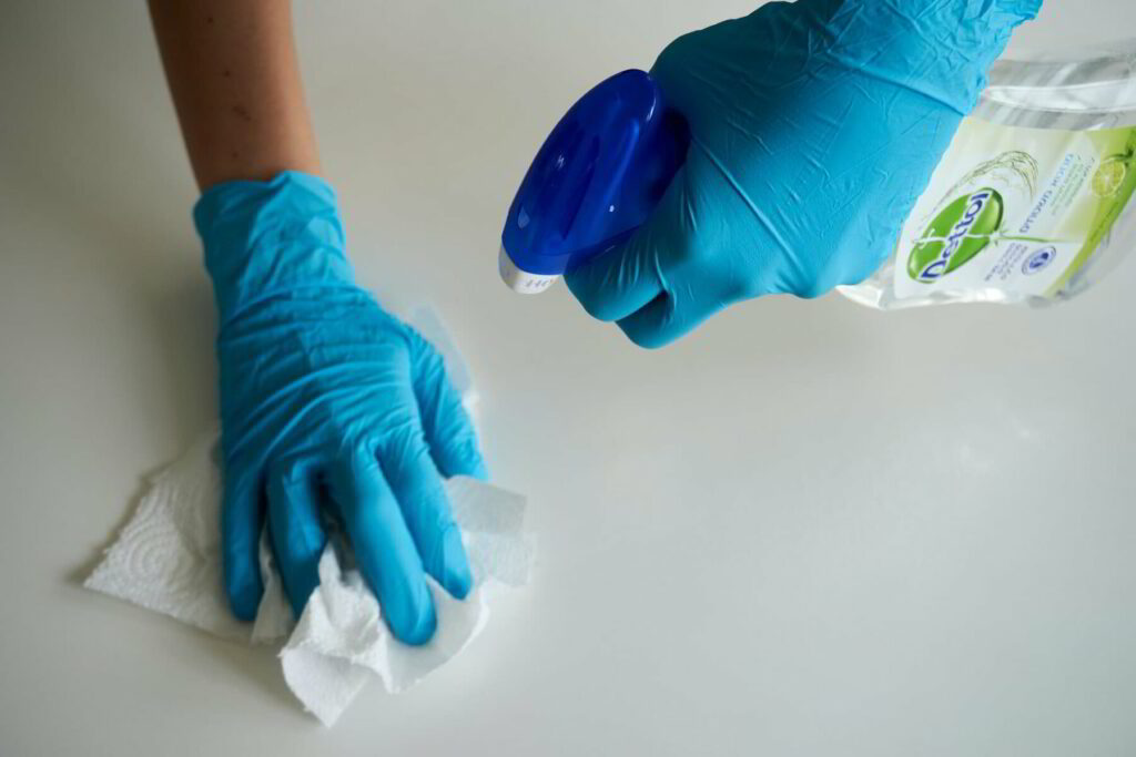 Commercial cleaner sanitizing a surface