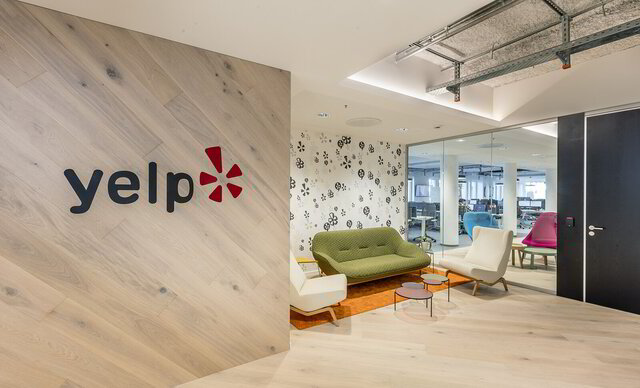 An image of an office with a Yelp logo