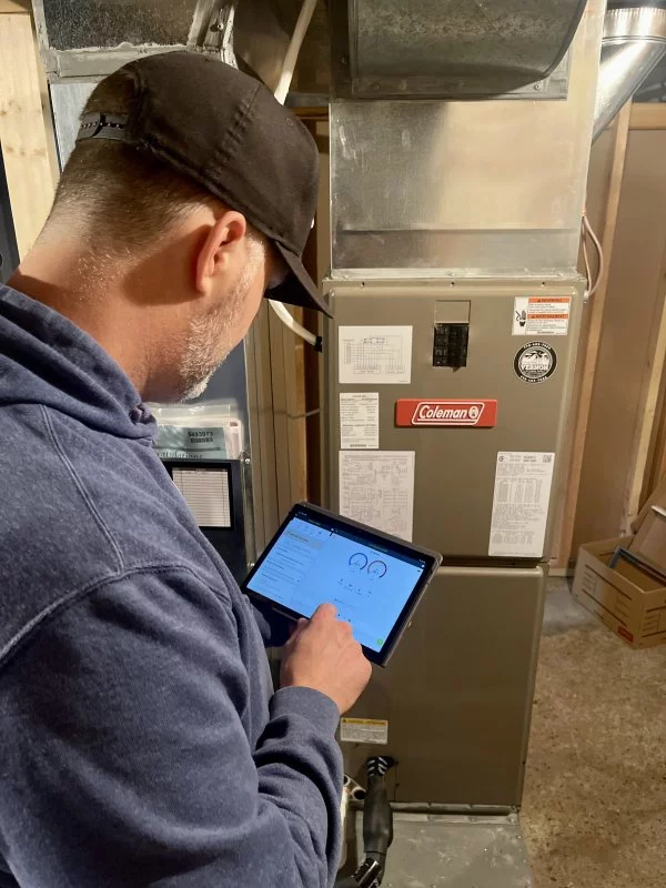 Phyxter HVAC tech conducting ductwork testing
