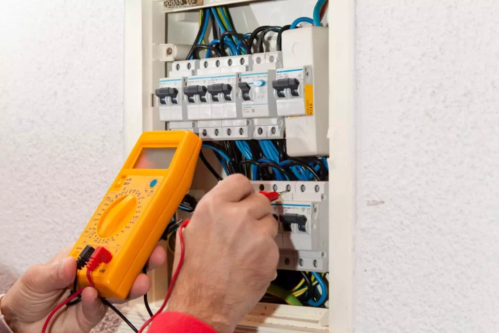 electrician checking circuit breakers
