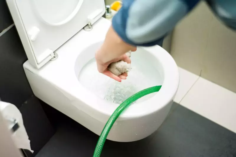 filling a toilet bowl with water