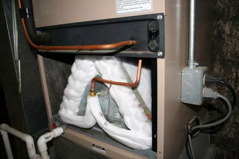 Frozen evaporator coil inside an indoor air handler