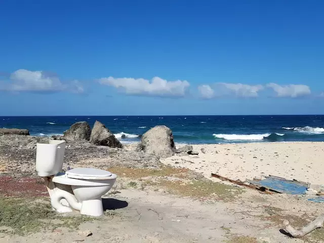 old toilet on a beach