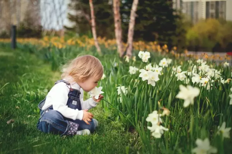 young-girl-smelling-flowers