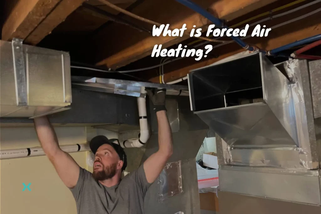 An HVAC technician showing what a forced air heating system is.