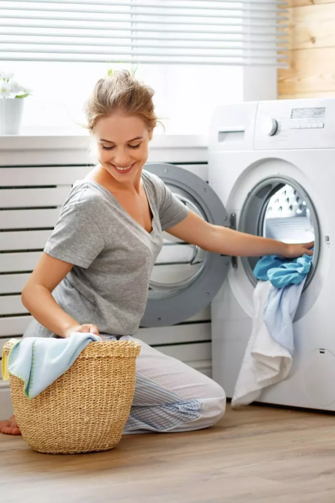 woman filling washing machine