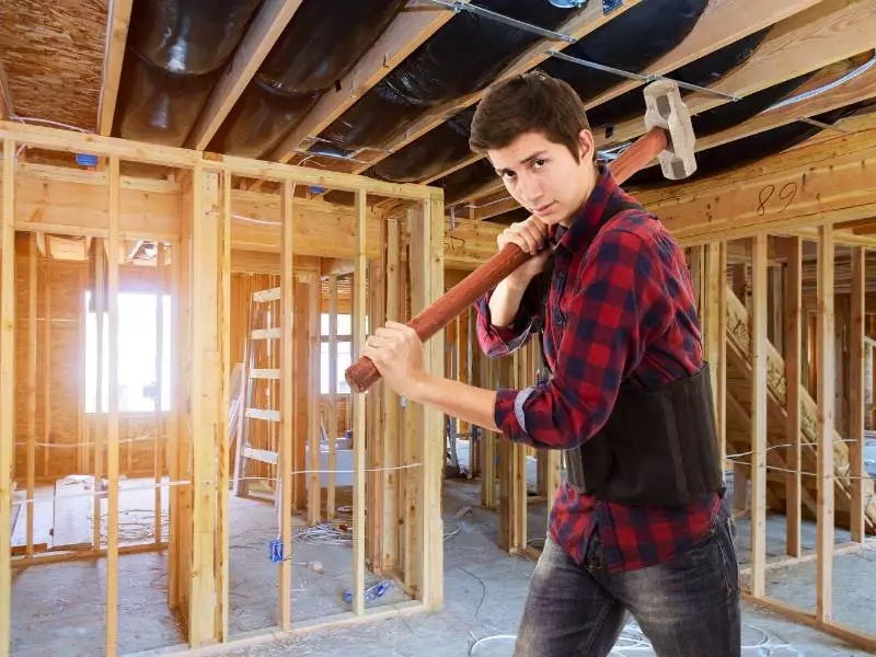 house builder with sledgehammer
