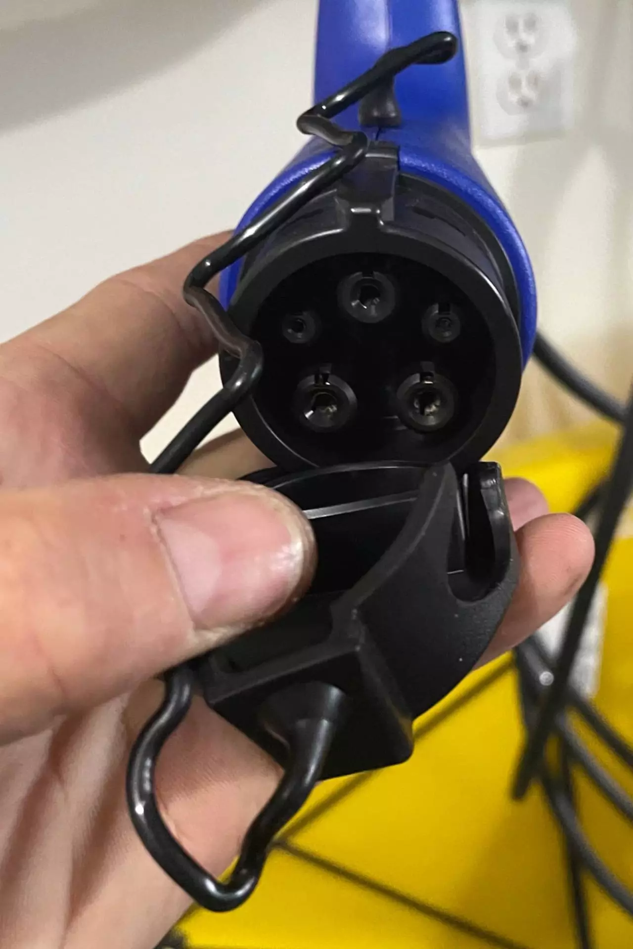 Electrician showing the internals of an EV Charging Adapter