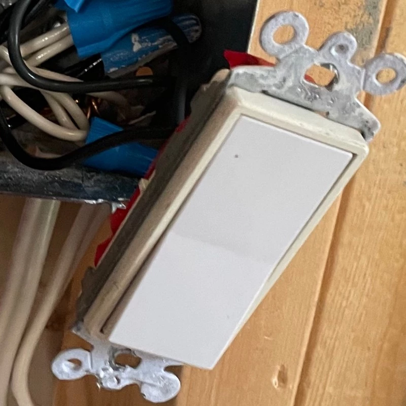 unprotected wiring behind light switch