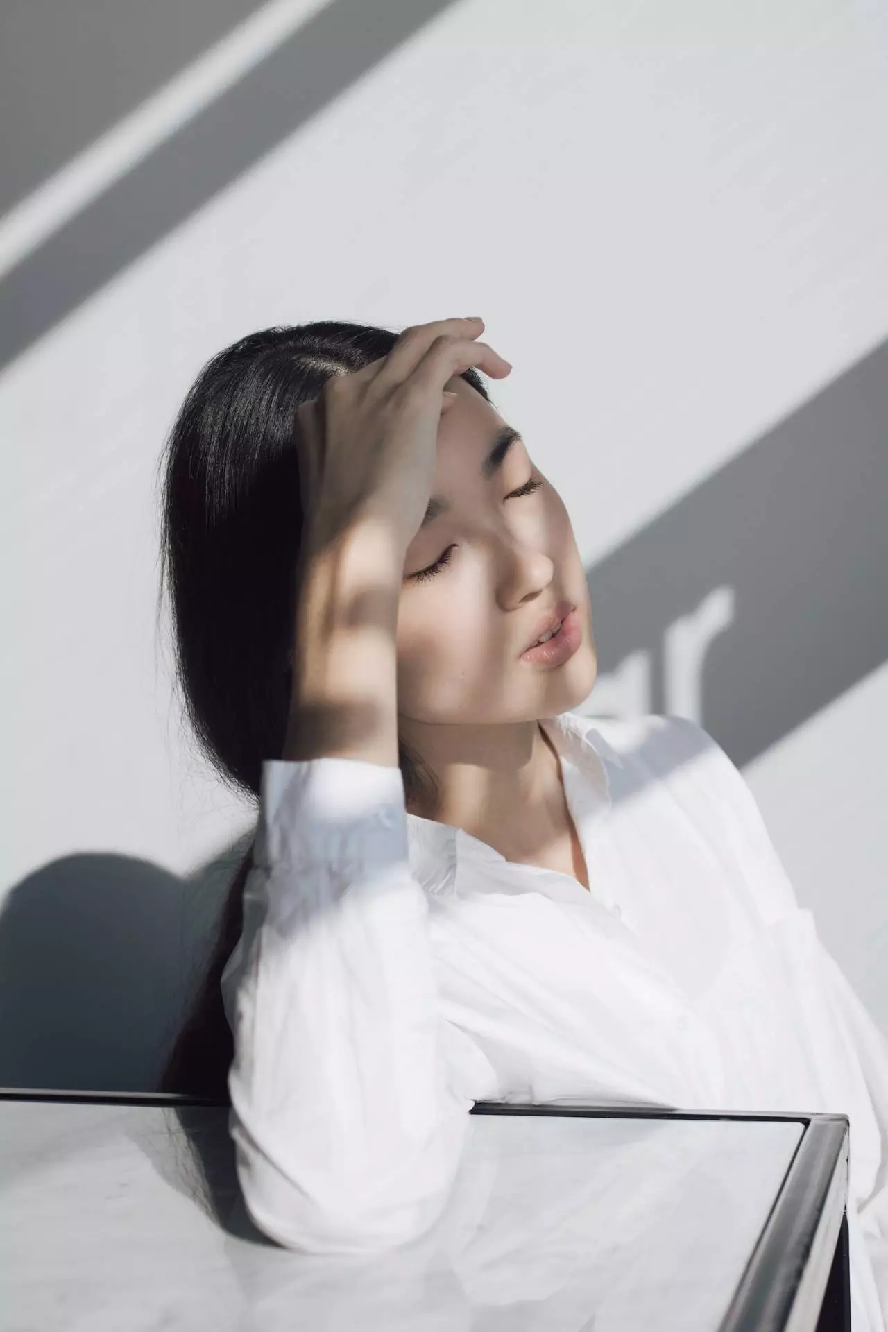 Asian woman with a headache