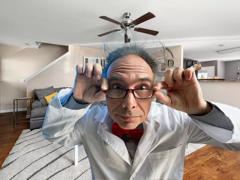 scientist checking out a ceiling fan