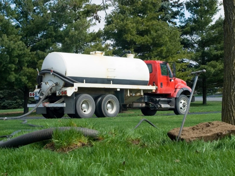 wastewater truck pumping out a septic tank
